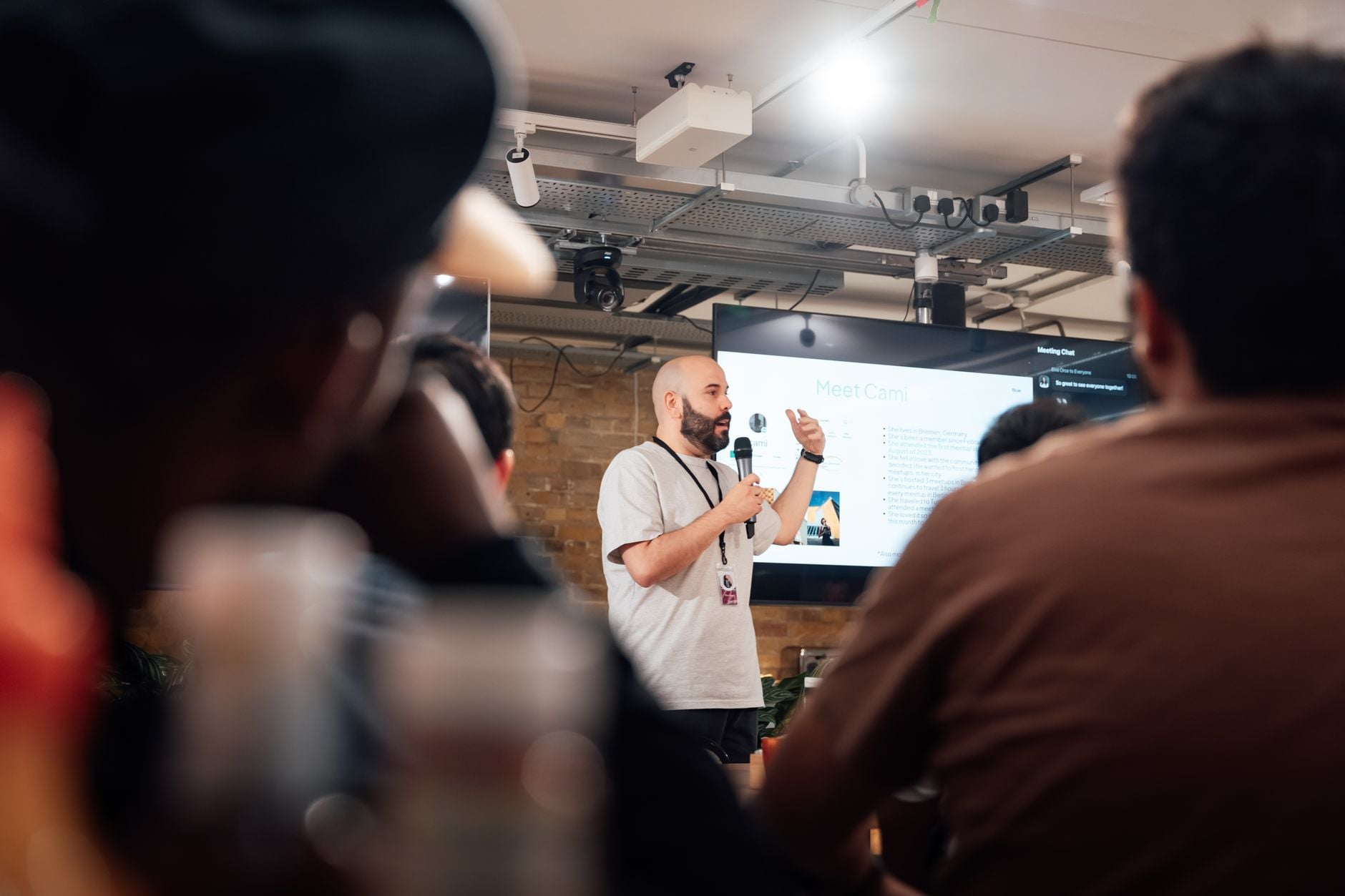 Engaging speaker presenting to an attentive audience during a tech event in London, illustrating Introducing AI Security Engineers Ottawa: What Event #2 Covered and How to Join