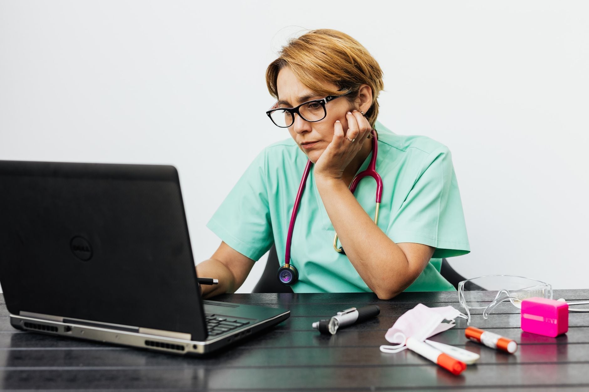 Clinician working on a laptop in a clinic, for PHIPA health-tech vendors