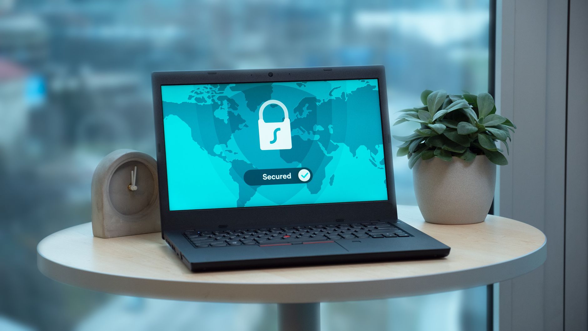 Laptop showing a padlock and world map, for PIPEDA privacy compliance
