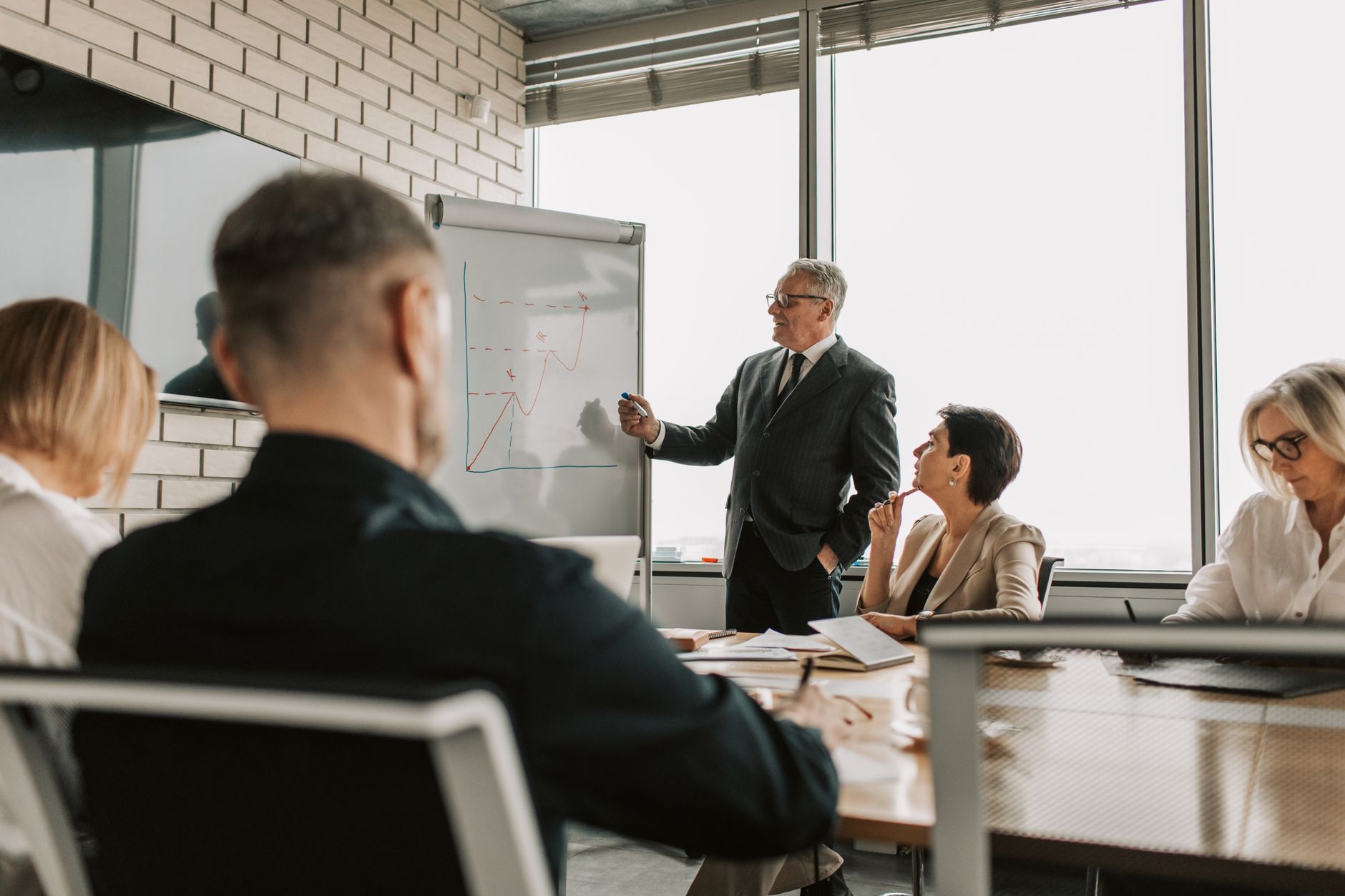 Stock photo by Vlada Karpovich via Pexels, illustrating security consultant advising executives boardroom (temporary placeholder pending custom hero design).