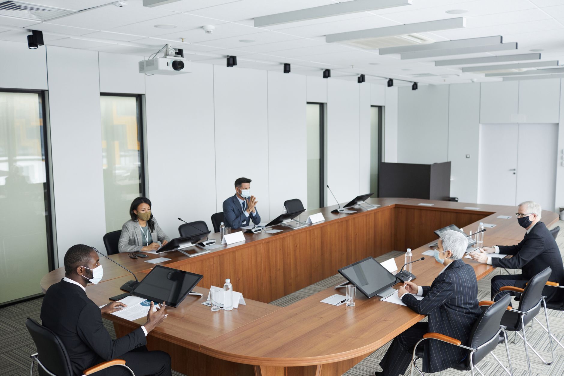 Stock photo by Werner Pfennig via Pexels, illustrating corporate board meeting (temporary placeholder pending custom hero design).