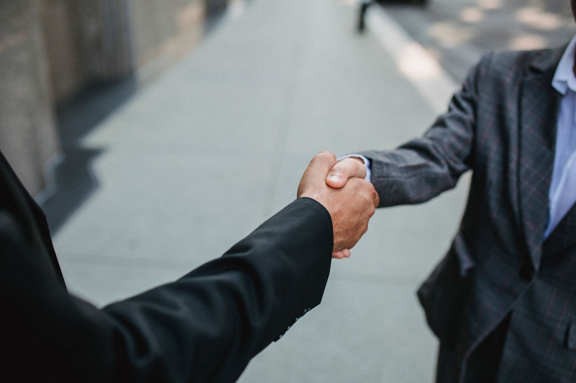 Stock photo by Ketut Subiyanto via Pexels, illustrating business partnership meeting (temporary placeholder pending custom hero design).