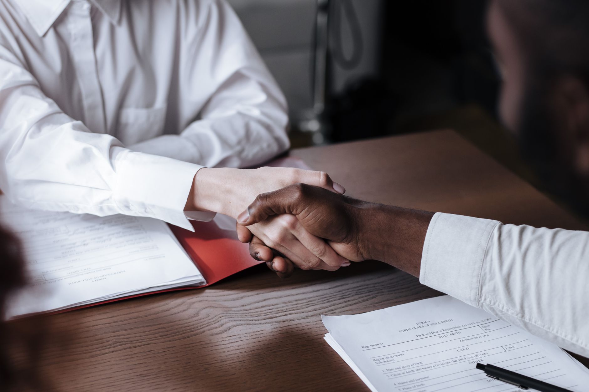 Stock photo by Ron Lach via Pexels, illustrating business contract handshake documents (temporary placeholder pending custom hero design).