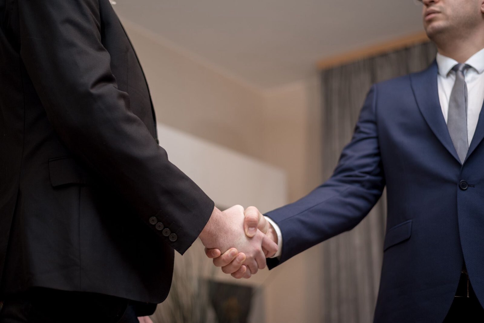 Stock photo by George Morina via Pexels, illustrating business handshake enterprise deal office (temporary placeholder pending custom hero design).