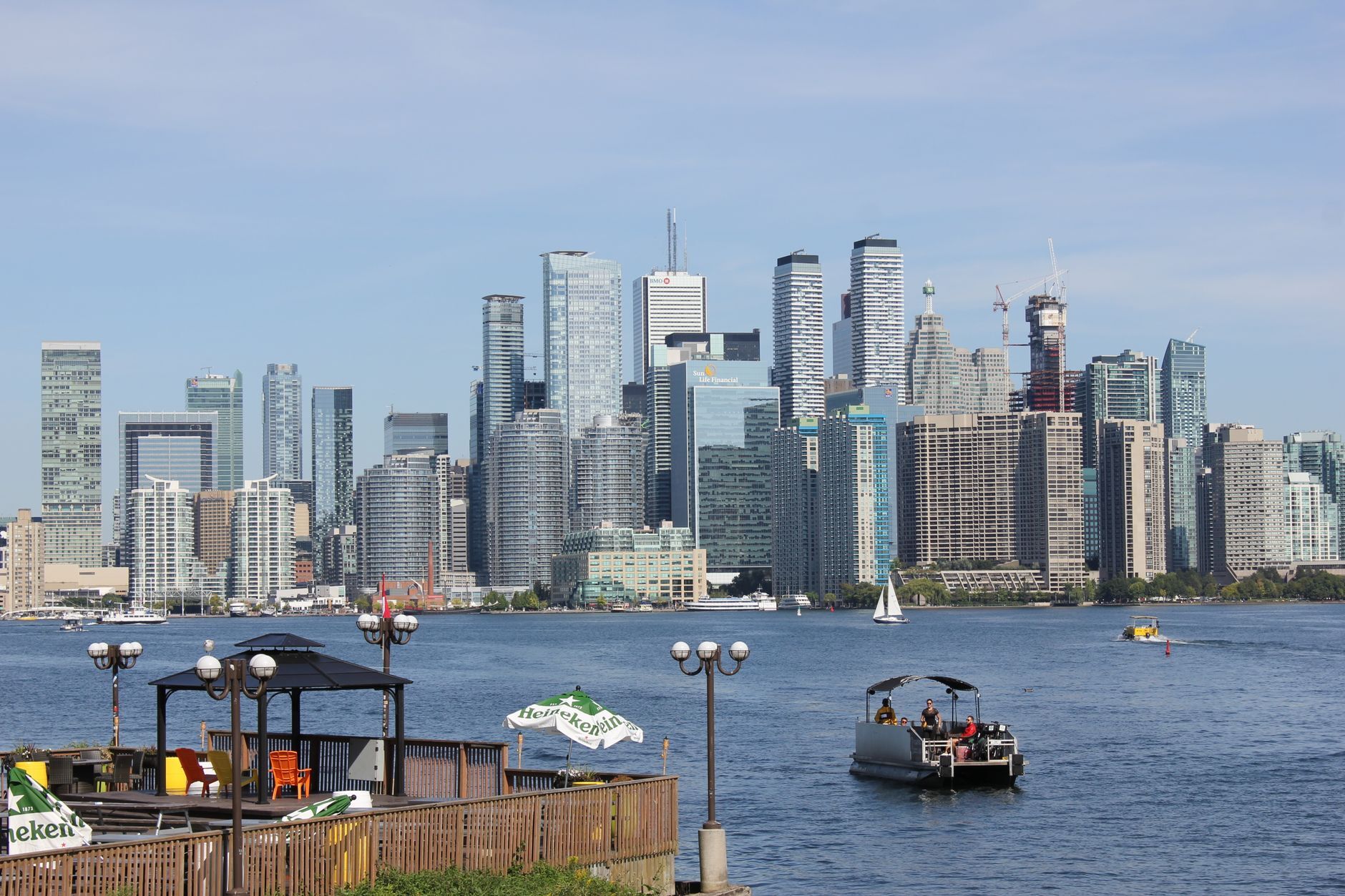 A vibrant view of the Toronto skyline with boats on the waterfront, illustrating Top ISO 27001 Consultants in Canada (2026): A Buyer's Guide