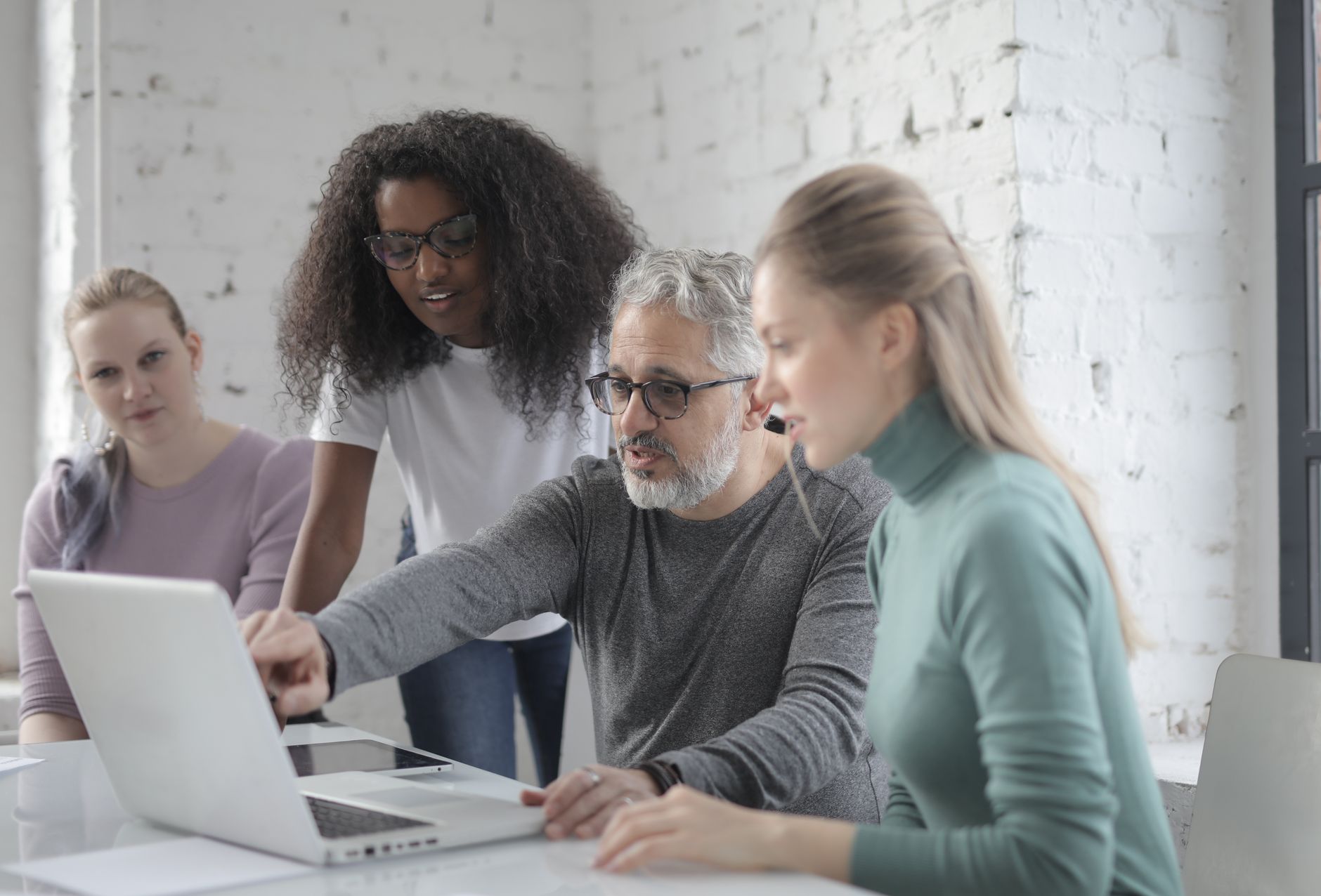 Stock photo by Andrea Piacquadio via Pexels, illustrating professional team meeting laptop office technology (temporary placeholder pending custom hero design).